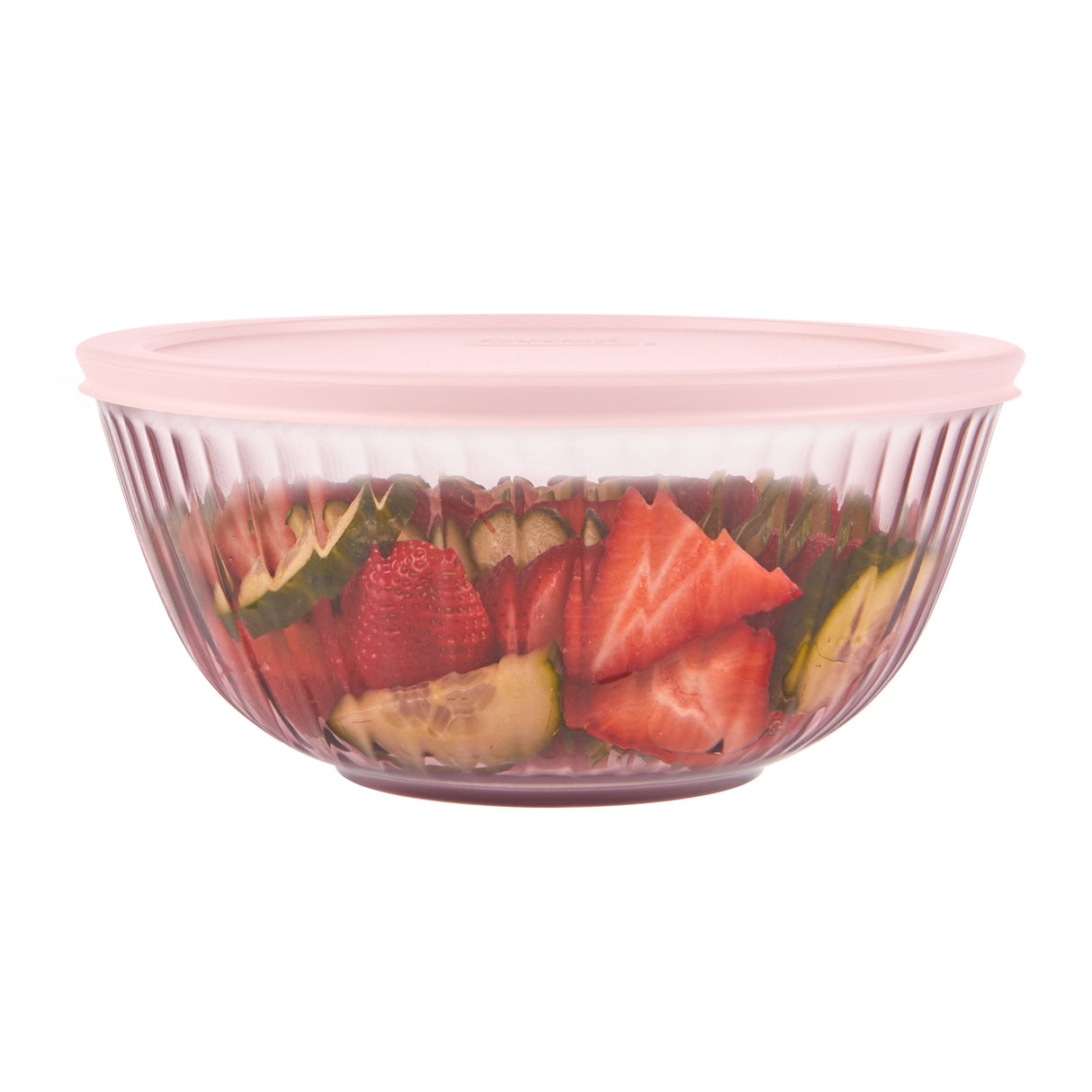 Clear glass bowl with pink lid containing sliced fruits on a white background
