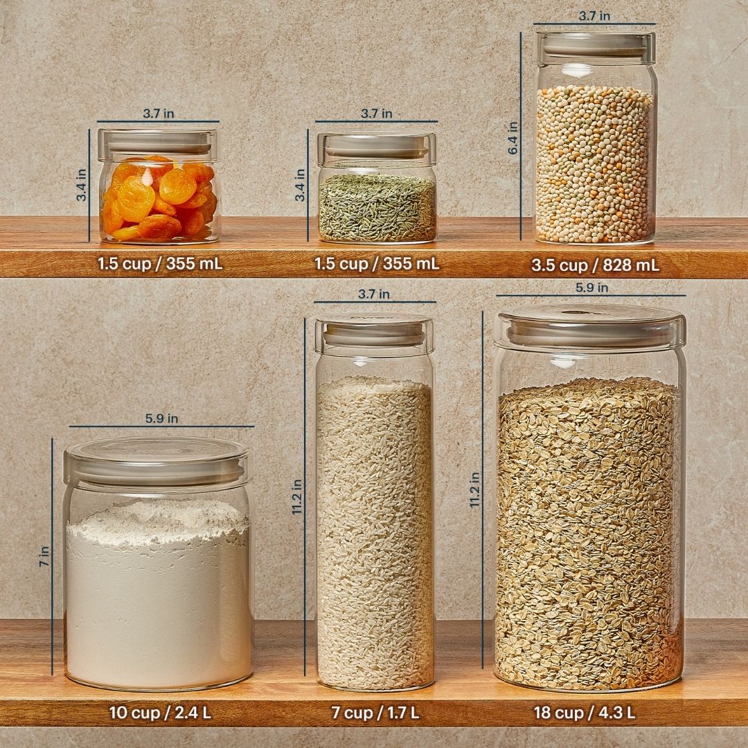 Glass jars with measurements and contents on a wooden shelf against a beige wall.