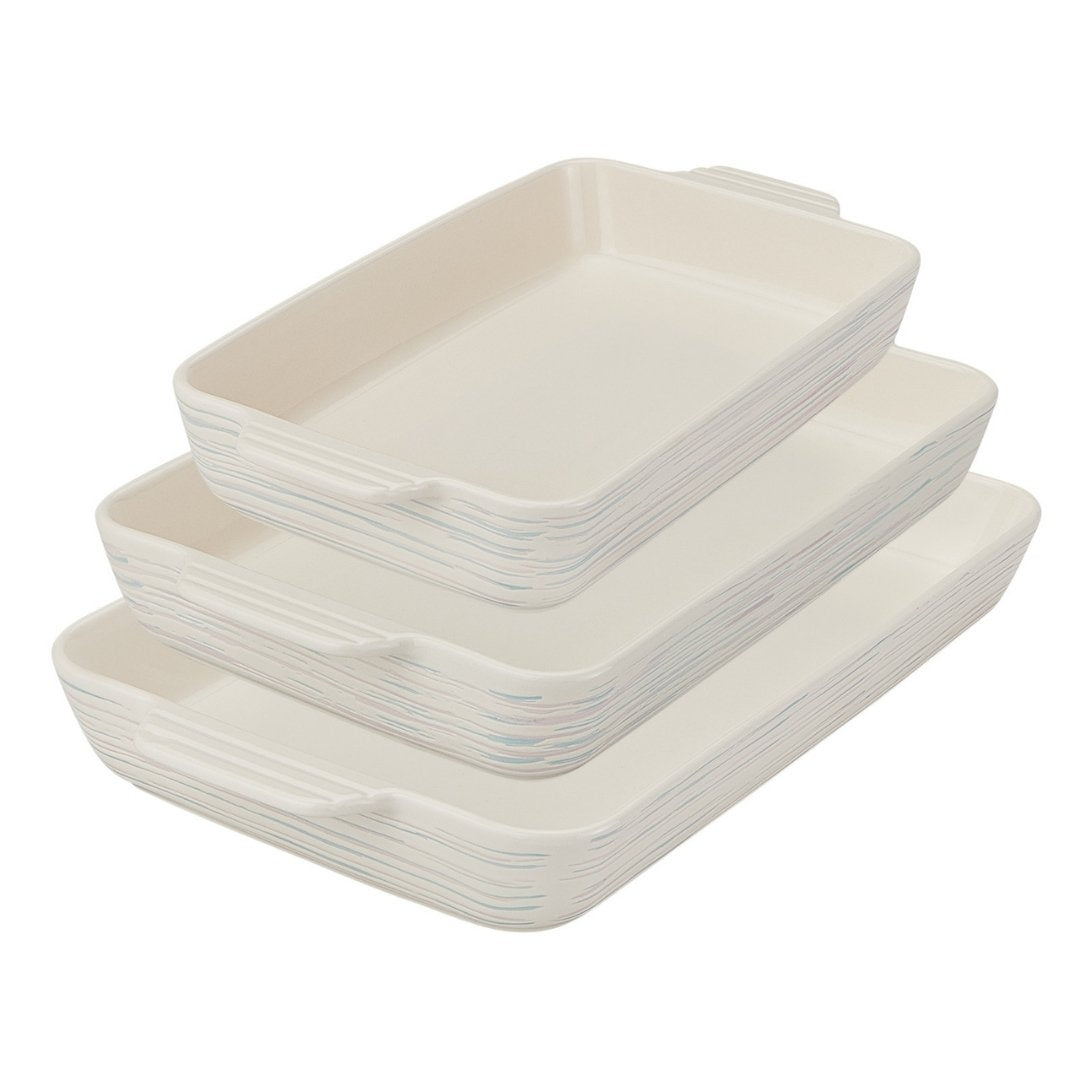 Set of white ceramic rectangular dishes stacked on a white background