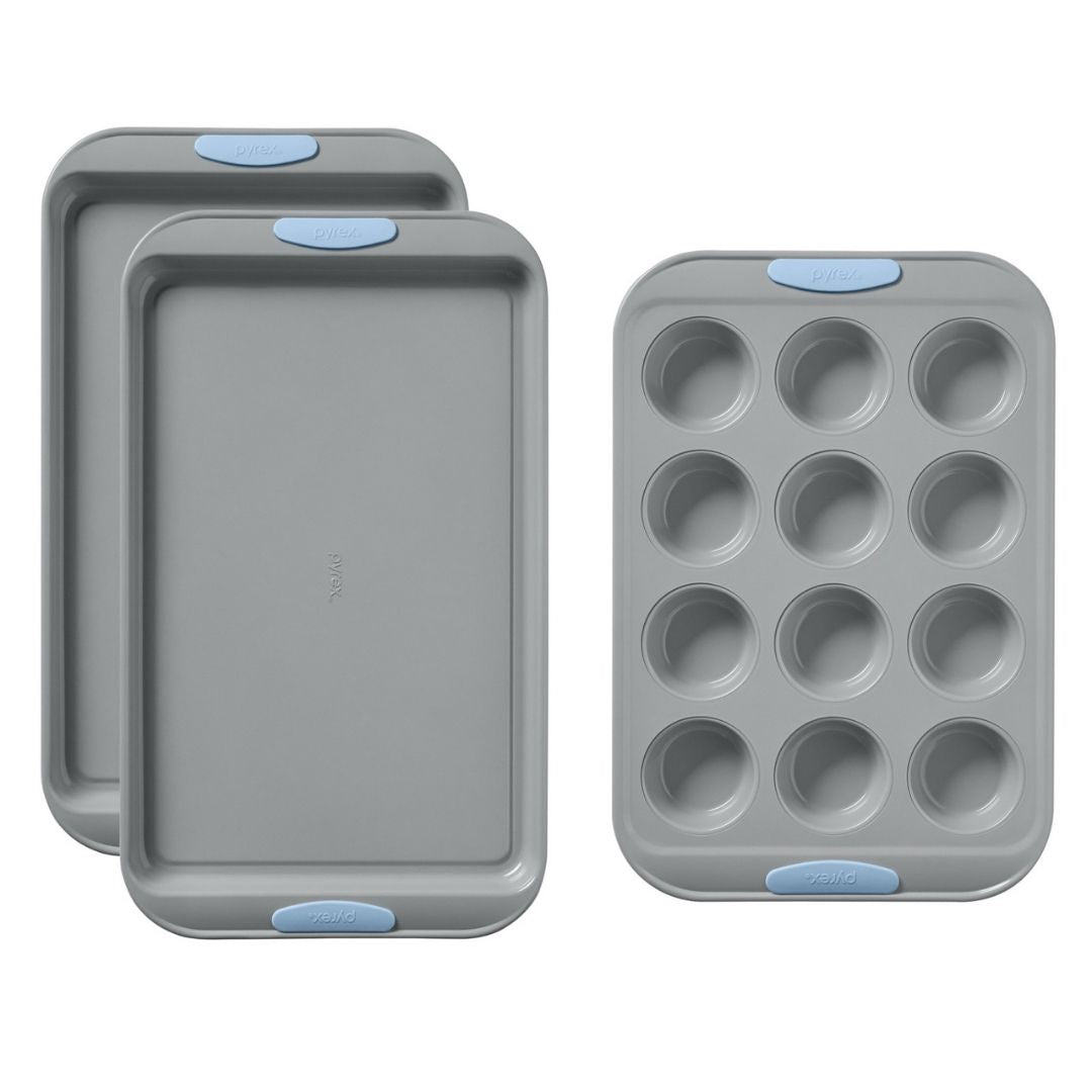 Set of gray baking trays with blue silicone grips on a white background