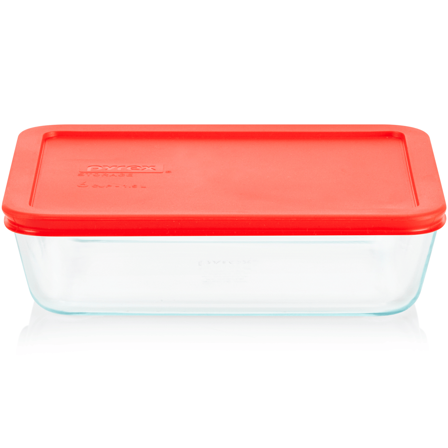 Clear glass food storage container with a red lid on a white background