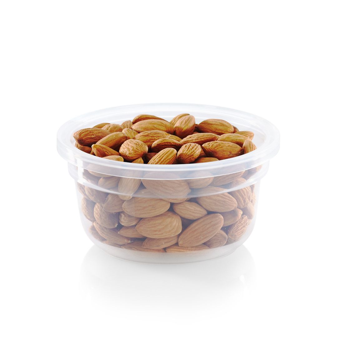 Clear plastic container filled with almonds on a white background